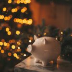White piggy bank from a federal credit union in Brownsville in front of Christmas tree
